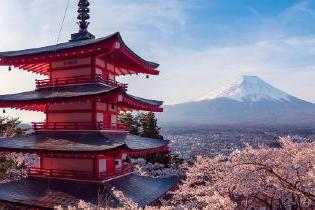 A Japanese pagoda with a view of mount Fuji. 